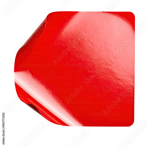Glossy red square sticker with peeling corner on black backdrop design element for graphic projects advertising material and presentations