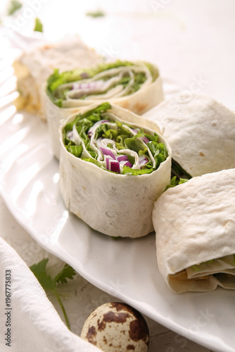 Plate of tasty lavash rolls...