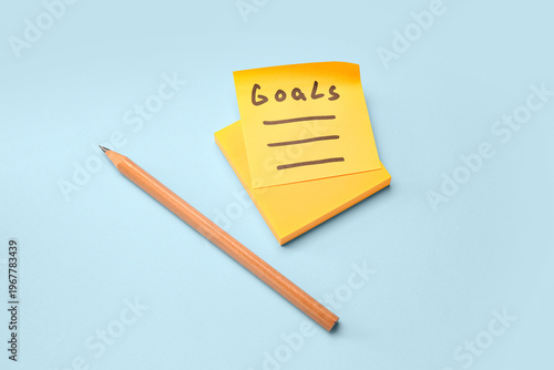 Sticky note with word GOALS...