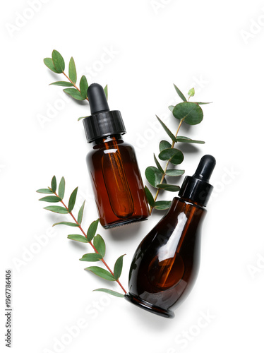 Bottles of cosmetic oil wit...