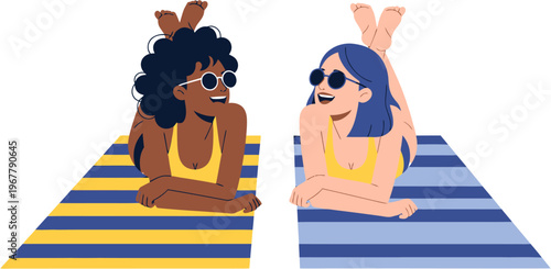 Two women in sunglasses relaxing on beach towels on a sunny day