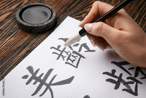 Female hand with Asian hier...