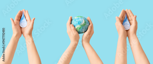 Hands holding model of Eart...