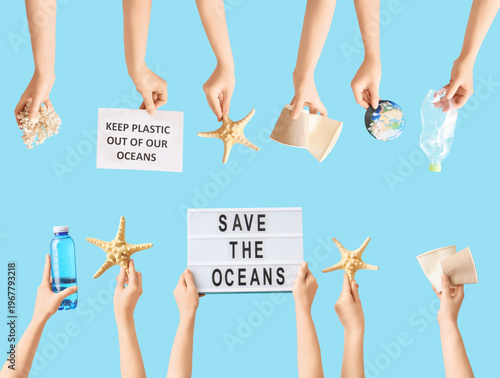 Many hands with plastic gar...