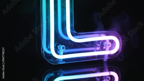 A glowing neon letter L with colorful light and wisps of smoke against a dark background, reflecting on a glossy surface