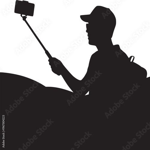 Silhouette of a man with a cap and backpack taking a selfie with a selfie stick on a bright day
