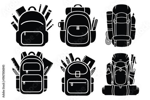 Black and white backpacks with school and travel supplies