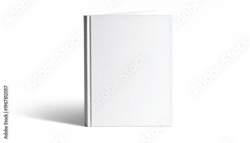 A partially opened book with white covers casts a shadow on a white background