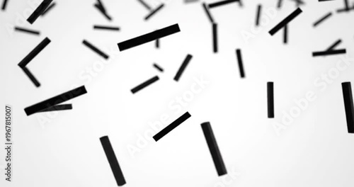 Abstract composition of falling black rectangles on a white background creating dynamic motion