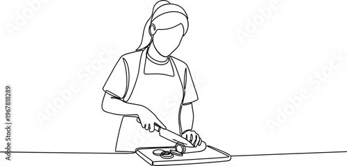 Woman cutting food on a board.
