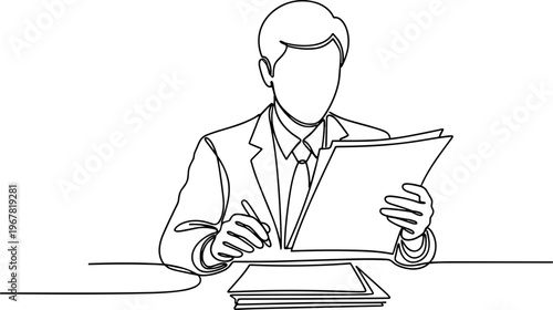 Businessman reading documents at desk.