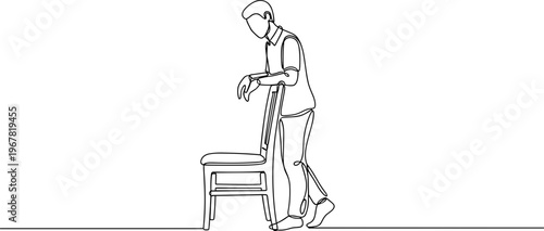 Man pushing chair across floor.