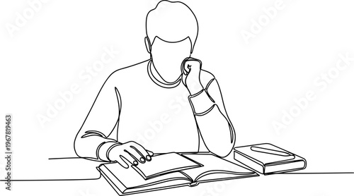 Man sitting at desk with books.