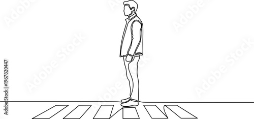 Man standing on crosswalk alone.