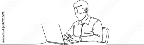 Man wearing mask using laptop computer.