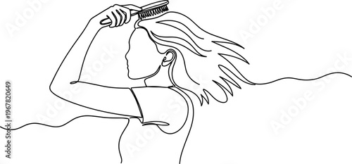 Woman combing her long flowing hair.