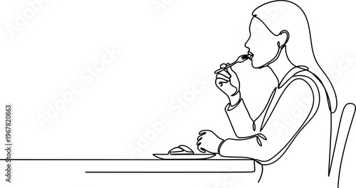 Woman eating at a dining table.