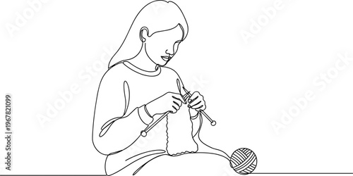 Woman playing with knitting yarn.
