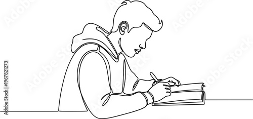 Young man writing in notebook.