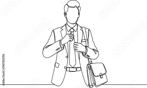Businessman in suit holding briefcase standing.