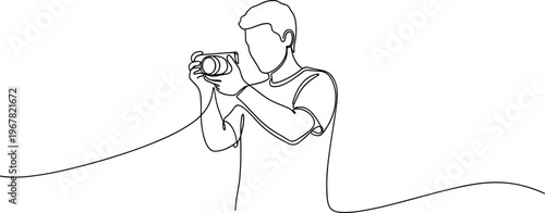 Man holding a camera device.