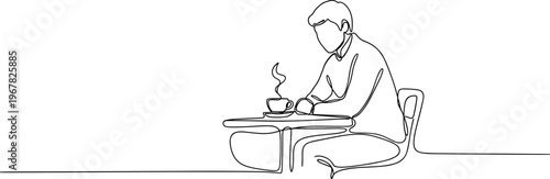 Man sitting at a table drinking.