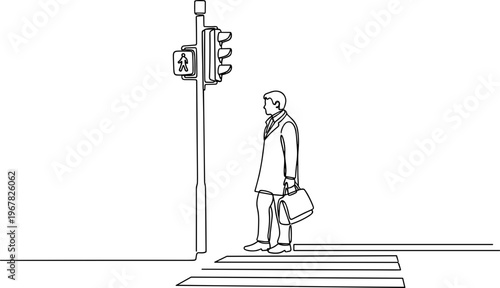 Businessman standing on crosswalk alone.