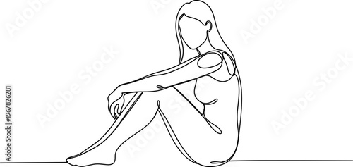 Woman sitting alone in sorrow.
