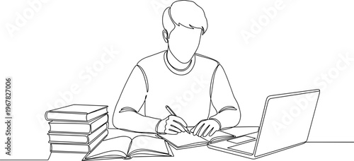 Man studying with laptop and books.