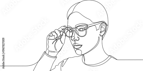 Woman adjusting her eyeglasses carefully.