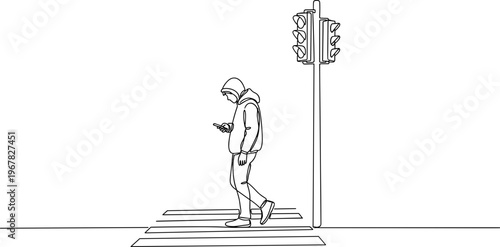 Person crossing street with phone.