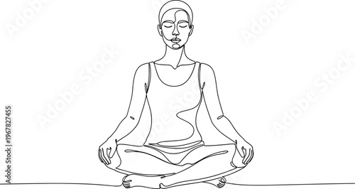 Woman in meditation sitting cross-legged.