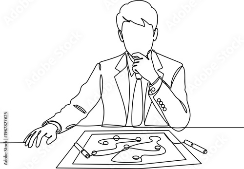Businessman studying a puzzle closely.
