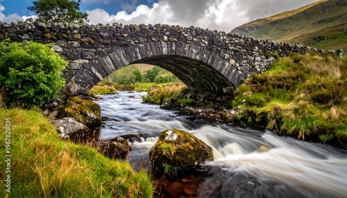 A serene stone bridge spans a gentle river