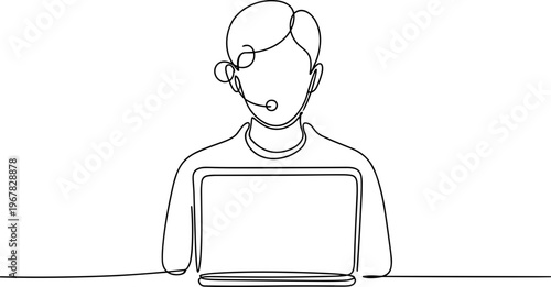Man wearing headset using laptop computer.