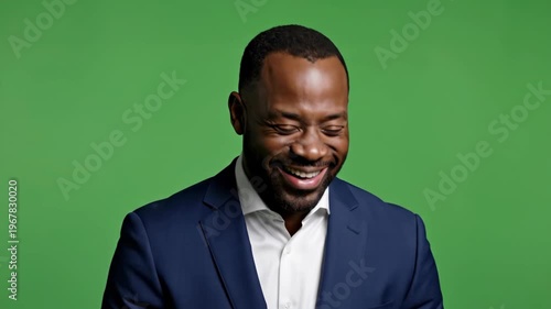 Smiling Businessman in Suit Against Green Screen