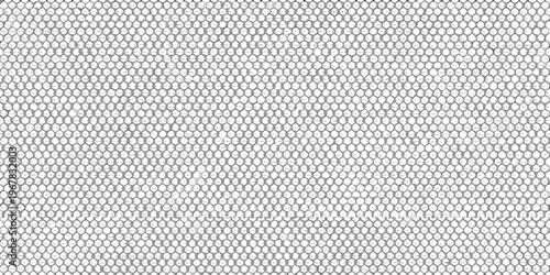 Close up of a woven textile with a repeating cellular pattern