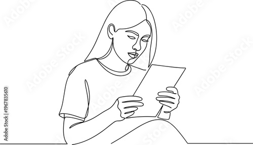 Woman looking at a tablet device.