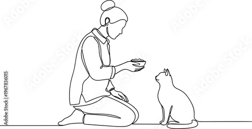 Woman offering food to a cat.