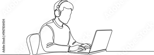 Man wearing headset using laptop computer.