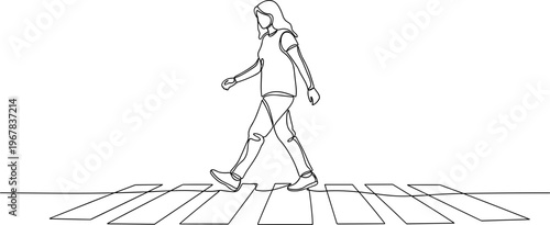 Woman walking across a crosswalk alone.