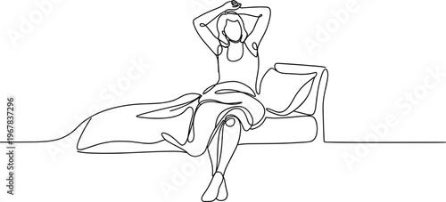 Woman sitting on couch relaxing.
