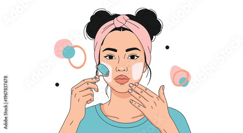 Young woman with her hair in space buns using a blue jade roller on her cheek for a relaxing facial massage during her beauty routine.
