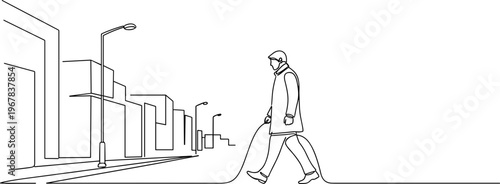 Man walking down city street alone.