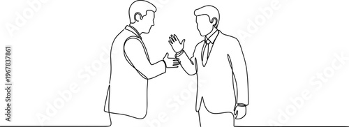 Two businessmen shaking hands in agreement.