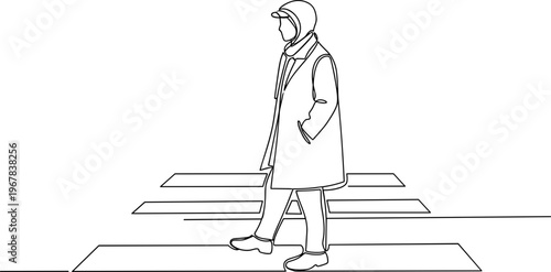 Man walking on a path outdoors.