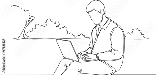 Man sitting with laptop computer outdoors.