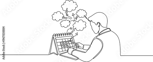 Man looking at calendar thinking.