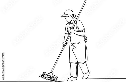 Person cleaning with a broom indoors.