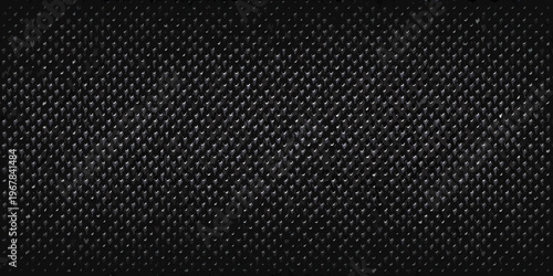 Close up of a dark textured surface resembling woven material